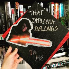 someone is holding up a graduation cap with the words that diploma belongs to me