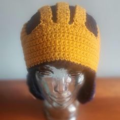 a crocheted hat on top of a mannequin head