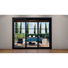 an open sliding glass door with the view of a pool and trees in the background