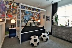 a bedroom with a soccer themed bed and dresser