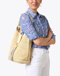 This beige raffia bag from Laggo is the perfect summer beach bag. Large enough to carry all of your essentials, this shoulder bag features a tassel and a braided leather handle. Pair this bag with a pair of jeans and a light top for a hot summer day. Natural Woven Leather Hobo Bag For Beach, Vacation Woven Leather Hobo Shoulder Bag, Natural Woven Leather Hobo Bag For The Beach, Woven Leather Hobo Shoulder Bag For Vacation, Beige Crochet Bag With Woven Leather, Beach Woven Leather Hobo Shoulder Bag, Summer Woven Leather Bucket Hobo Bag, Beach Hobo Shoulder Bag In Woven Leather, Chic Cream Jute Straw Bag