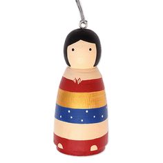 a wooden doll ornament on a white background