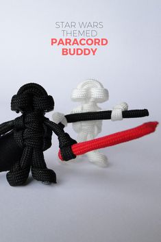 two small knitted toys holding onto each other with the words star wars attached to them