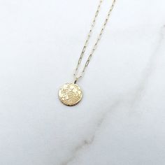 Gold Circle Charm Necklace In Sterling Silver, Gold Sterling Silver Round Disc Charm Necklace, Delicate Moon Phase Round Pendant Jewelry, Delicate Hammered Round Pendant Jewelry, Dainty Engraved Round Pendant Coin Necklace, Delicate Round Charm Necklace Tarnish Resistant, Dainty Sterling Silver Medallion Coin Necklace, 14k Gold Filled Charm Necklace With Coin Pendant, Gold Sterling Silver Coin Necklace With Round Pendant