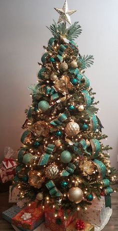 a decorated christmas tree with presents under it