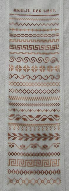 a white towel with brown designs on it