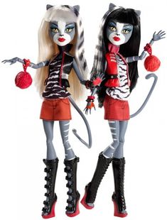 two dolls are standing next to each other