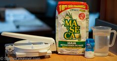 ingredients for making homemade macaroni and cheese sitting on a counter next to a blender