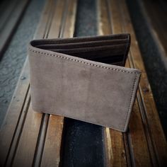 Product Type: Leather wallet  Material: Leather  Leather Type: Genuine leather  Uses: Multi  Feature: (1) This wallet has a total of 7 slip pockets  (2) 4 small and 2 main big pocket one zipper and one snap closer pocket   Size: L 6.5 H 4 (inch) L16.61 H 10.16 (cm)  Color: Brown, dark grey Brown Bifold Wallet With Zipper Pocket, Brown Wallets With Zipper Pocket For Everyday Use, Classic Brown Wallet With Zipper Pocket, Brown Leather Trifold Wallet With Zipper Closure, Bifold Coin Purse With Zipper Pocket For Everyday, Everyday Bifold Coin Purse With Zipper Pocket, Everyday Bifold Coin Purse With Zipper, Leather Trifold Wallet With Zipper Pocket For Daily Use, Classic Leather Wallet With Zipper Pocket