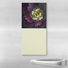 a close up of a refrigerator door with a flower on it