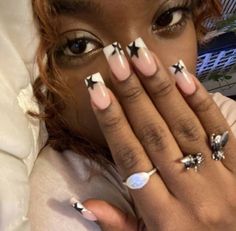 a close up of a person with rings on their fingers