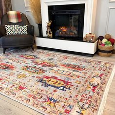 a living room with a fireplace and rugs on the floor