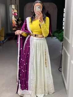 Big Indian Fate Wedding Georgette White Color Lehenga Choli With Wine Georgette Dupatta and Yellow Choli, Item code: KTLNB1503, Price: 86.99 USD, Fabric: Georgette, Color: White, Occasion : Wedding, Size: Semi Stitch, Stitching: Custom Stitch, Without Stitch, Gender: Women. Yellow Choli, White Color Lehenga, Fashion Lehenga, Tassels Blouse, Tassel Blouse, Navratri Festival