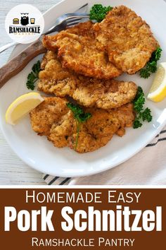 homemade easy pork schnitzel recipe on a white plate with lemon wedges