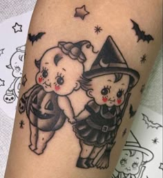 a couple of teddy bears on top of each other with a witch's hat