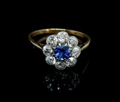 an antique sapphire and diamond cluster ring