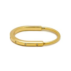 Tiffany & Co.  Lock Bangle in Yellow Gold with Diamond Accents Wrist Aficionado Adjustable Open Ring Yellow Gold Bracelet, Modern Gold Open Ring Bracelet, Modern Hoop Bangle For Everyday, Modern Hoop Bangle For Everyday Wear, Modern Adjustable Oval Bangle, Stackable Open Ring Bracelets For Everyday, Modern Adjustable Hoop Bracelets, Everyday Yellow Gold Open Ring Bracelets, Everyday Yellow Gold Open Ring Bracelet