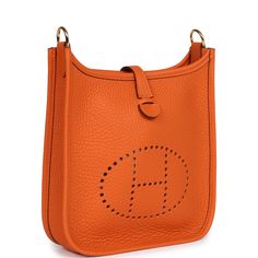 This Evelyne is in Orange clemence leather with gold hardware and has tonal stitching, pull tab top closure and an Orange removable canvas and leather shoulder/crossbody strap.The interior is lined with Orange natural leather.Collection: BOrigin: FranceCondition: New and never wornAccompanied by: Hermes box, Hermes dustbag, shoulder strap, shoulder strap dustbag and carebookMeasurements: 6.75" width x 7" height x 2" depth; 23" strap drop Hermes Evelyne Tpm, Hermes Evelyne Iii, Fake Designer Bags, Hermes Birkin 25, Hermes Box, Birkin 25, Backpack Tote Bag, Hermes Bags, Pull Tab