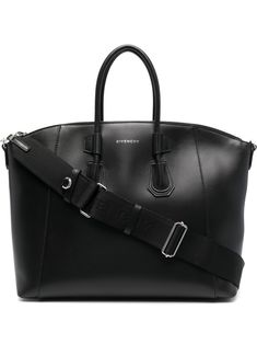 Antigona Sport tote bag from GIVENCHY featuring calf leather, logo print to the front, two rounded top handles, adjustable detachable shoulder strap, internal zip pocket and top zip fastening. | Givenchy Antigona Sport tote bag Givenchy Tote Bag, Sport Tote Bag, Givenchy Antigona, Givenchy Bag, Tote Bag Black, Chanel 2, Iconic Bags, Givency Antigona Bag, Leather Logo