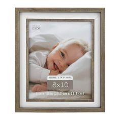 a wooden frame with an image of a baby in it