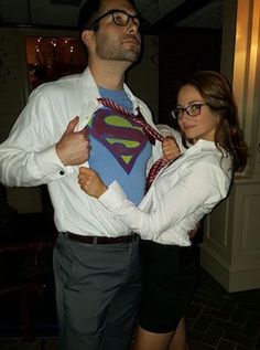 a man and woman are dressed up as superman and the girl is wearing a tie