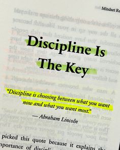 an open book with the words discipline is the key written in green and yellow on it