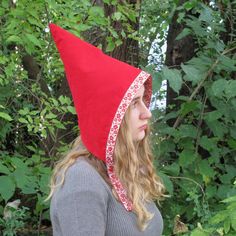 Girls pixie hat is made with red cotton corduroy, and is reversible to red and white gingham print flannel. The brim of the cap is trimmed with vintage jacquard ribbon. The bonnet closes under the chin with two sets of snaps for an adjustable fit. The hat covers the ears so it will be toasty warm. Wear it as part of a gnome costume, elf costume, woodland sprite... Available in size 6 - 12 months , 1 - 3 years, 4 - 8 years, and Adult size. Machine wash and tumble dry low. The fabrics have been ca Whimsical Red Winter Hat, Fantasy Festival Costume Hats And Headpieces In Red, Handmade Red Costume Hats And Headpieces, Woodland Sprite, Gnome Costume, Costume Toddler, Red Garden, Girl Elf, Jacquard Ribbon