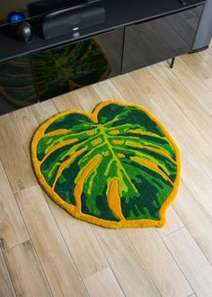 a green and yellow rug on the floor