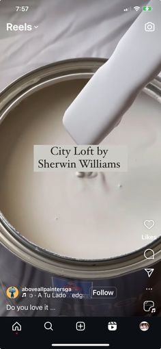 a white paint can being painted with the words city loft by sherylin williams