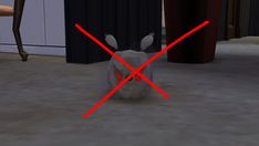 a white rabbit with red lines across it's face sitting on the floor in front of a chair