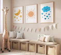 a room with some pictures on the wall and a stuffed giraffe