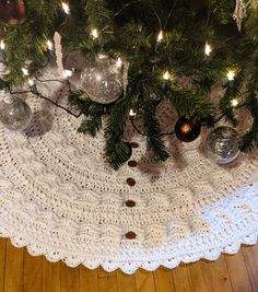 a crocheted doily under a christmas tree