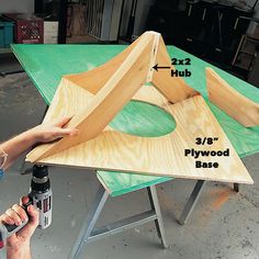 a person is working on a table with plywood base and glue to finish it