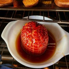 a bowl filled with food sitting on top of an oven