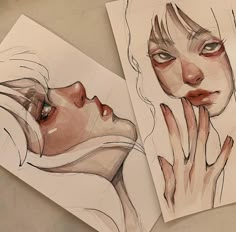 two drawings of woman's faces on paper