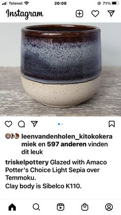 a black and white ceramic bowl sitting on top of a wooden table next to an instagram page