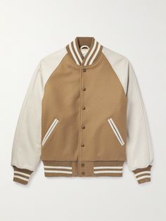 "The people who wear them put in so much mileage, " says Golden Bear of its heavy-duty bomber jackets, recalling customers that are going on 20-plus years with theirs. Inspired by varsity styles, 'The Ralston' is made from a combination of an insulating wool-blend and leather, and has non-pill ribbed trims that do a good job of keeping in warmth. Varsity Jacket Outfit, Black Cotton Jacket, Leather Varsity Jackets, Golden Bear, Womens Jackets Casual, Varsity Jacket Men, Letterman Jacket, Nike Tech, Brown Leather Jacket