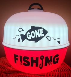 a light up bowl with a fish on it and the words gone in black lettering