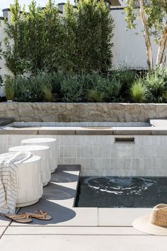 an outdoor hot tub in the middle of a courtyard