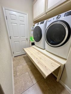 a washer and dryer sitting on top of a shelf in a laundry room