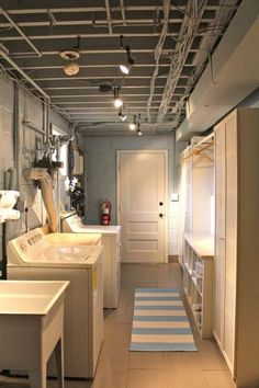 this is an image of a laundry room with washer and dryer in it