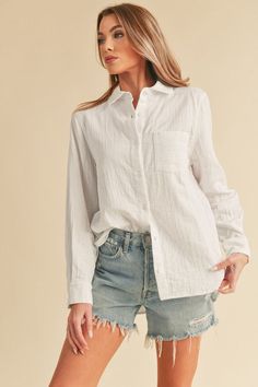 Presenting our plush cotton button-down Nattie shirt, a modern update to the classic style. Embrace the oversized, slouchy silhouette for a contemporary twist. Complete with a bust patch pocket detail, rounded bottom hem, and exaggerated side slits, this shirt exudes both comfort and chic sophistication. Perfect for effortlessly elevating your everyday look.Maxi DressDressChunky cable knit beanieTops SandalsSetsDenimSpringTrucker hatsWesternMidi DressCardiganEaster Style: Casual Print / Pattern: Relaxed Button-up Shirt With Rolled Sleeves, Relaxed Fall Shirt For Everyday Wear, Relaxed Everyday Shirt For Fall, Relaxed Everyday Fall Shirt, Relaxed Fit Top With Button Closure And Shirttail Hem, Trendy Everyday Shirt With Button Cuffs, Trendy Shirt With Shirttail Hem For Daywear, White Button-up Tops With Patch Pockets, Trendy Everyday Shirt With Shirttail Hem