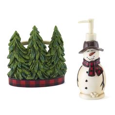 a snowman soap dispenser next to a pine tree shaped soap dispenser