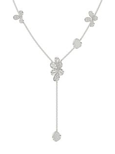 The Floral White Gold Y Necklace is an 18 karat white gold chain with a diamond six-petal flower at its center. The delicate chain is blossoming with flowers and circular diamond discs. Luxury Silver Flower-shaped Diamond Necklace, Luxury Silver Diamond Necklace In Flower Shape, Elegant Flower-shaped Jewelry With Single Cut Diamonds, Elegant Flower Shaped Jewelry With Single Cut Diamonds, Formal White Gold Diamond Necklace With Detachable Pendant, Luxury Flower Shaped Necklace With Brilliant Cut, Luxury Flower Necklace With Brilliant Cut, Luxury Flower-shaped Necklace With Brilliant Cut, Luxury White Diamond Necklace With Flower Pendant