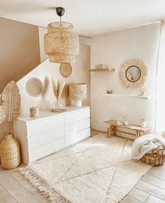 a living room filled with lots of furniture and decor on top of a white rug