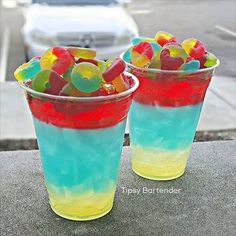 two plastic cups filled with gummy bears