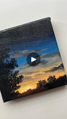 an image of a sunset with trees and clouds painted on it's canvases