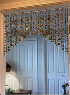 an open door with beads hanging from it