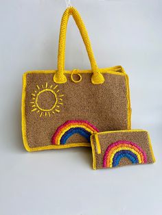 two purses are shown with the handles made out of jute and yellow yarn