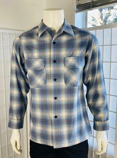 "Vintage Pendleton Mens Blue Gray Plaid Wool Board Shirt, Sm. Good condition.  Sm  C; 44\" SL; 24\" L; 29\"" Blue Fitted Long Sleeve Flannel Shirt, Blue Collared Shirt With Welt Pockets, Fitted Blue Shirt With Welt Pockets, Classic Blue Long Sleeve Flannel Shirt, Classic Blue Collared Flannel Shirt, Classic Blue Flannel Shirt With Button Closure, Classic Fitted Collared Flannel Shirt, Classic Blue Flannel Shirt For Fall, Fitted Blue Flannel Shirt For Fall